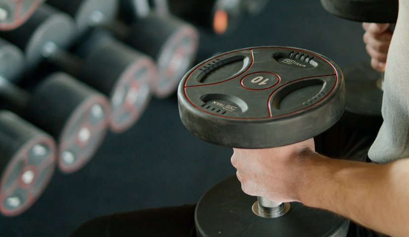 man lifting weights