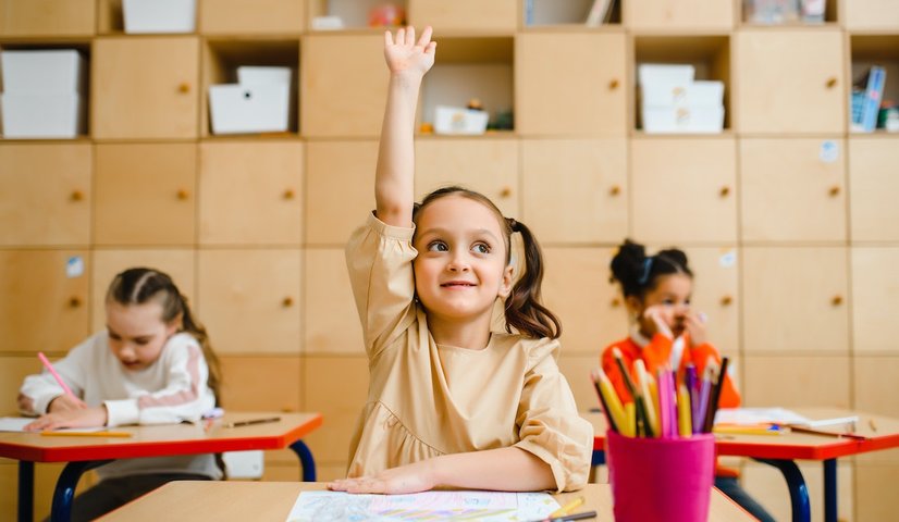 child raising hand